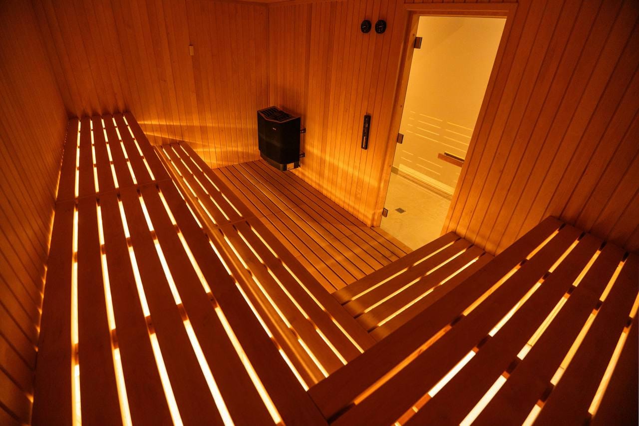 The wooden sauna, lit warm